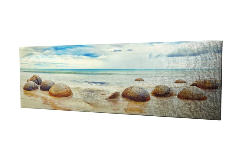 Canvas-taulu 80x30 cm - Pyöreitä kiviä rannalla, taustalla meri ja taivas - Sininen / Beige / Harmaa - Sisustustuotteet - Taulu & taide - Canvas-taulu