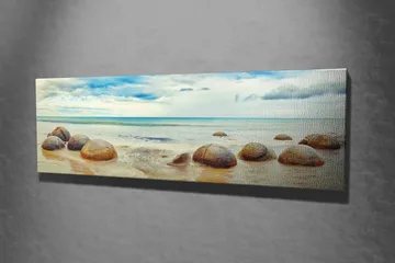 Canvas-taulu 80x30 cm - Pyöreitä kiviä rannalla, taustalla meri ja taivas - Sininen / Beige / Harmaa - Sisustustuotteet - Taulu & taide - Canvas-taulu