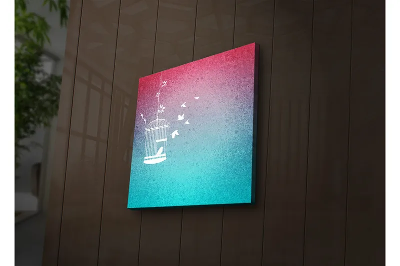 Canvas-taulu LED-valaistuksella 28x28 cm - Lumoava lintuhäkki lentävillä linnuilla unenomaisella taustalla, Vaaleanpunainen / Turkoosi