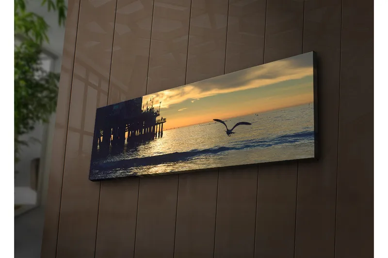 Canvas-taulu LED-valaistuksella 30x90 cm - Auringonlasku meren yllä lennossa olevan linnun kanssa - Oranssi / Sininen / Harmaa - Sisustustuotteet - Taulu & taide - Canvas-taulu