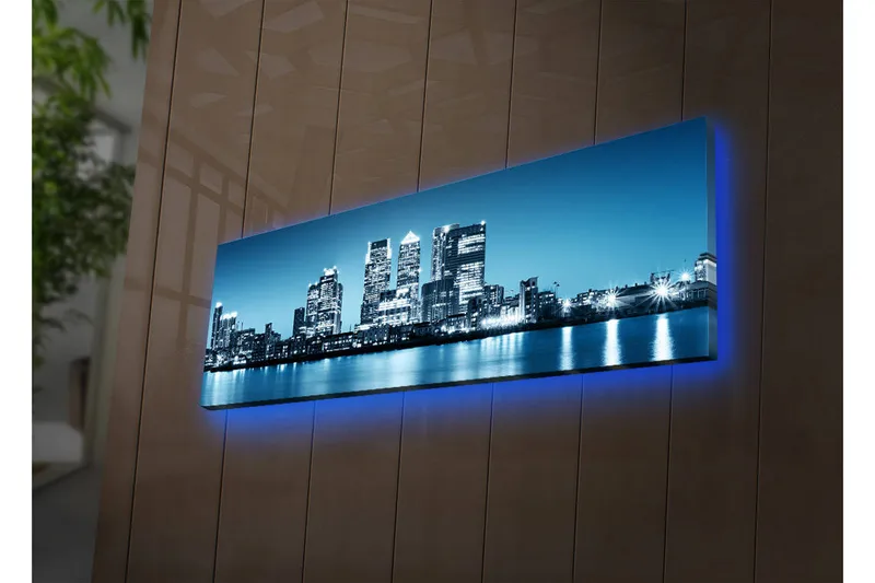 Canvas-taulu LED-valaistuksella 30x90 cm - Kaupungin siluetti moderneilla pilvenpiirtäjillä veden reunalla, Sininen / Musta / Valkoinen