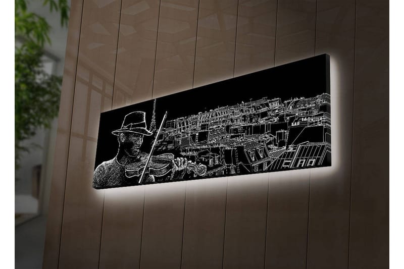 Canvas-taulu LED-valaistuksella 30x90 cm - Muusikko soittaa viulua kaupungin siluetin taustalla, Musta / Valkoinen