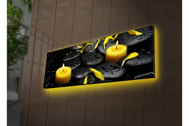 Canvas-taulu LED-valaistuksella 30x90 cm - Rauhoittava sommitelma mustilla kivillä ja palavilla kynttilöillä, Musta / Keltainen / Harmaa