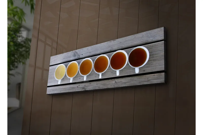 Canvas-taulu LED-valaistuksella 30x90 cm - Rivi kahvikuppeja eri juomasävyillä - Vaaleankeltainen / Ruskea / Oranssi - Sisustustuotteet - Taulu & taide - Canvas-taulu