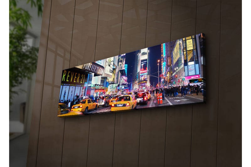 Canvas-taulu LED-valaistuksella 30x90 cm - Vilkas kaupunkikuva keltaisilla takseilla yöllisessä ympäristössä - Keltainen / Sininen / Musta - Sisustustuotteet - Taulu & taide - Canvas-taulu