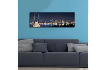 Canvas-taulu LED-valaistuksella 30x90 cm - Yöllinen kaupunkikuva sillalla ja pilvenpiirtäjien silueteilla - Tummansininen / Vaaleanvihreä / Valkoinen - Sisustustuotteet - Taulu & taide - Canvas-taulu