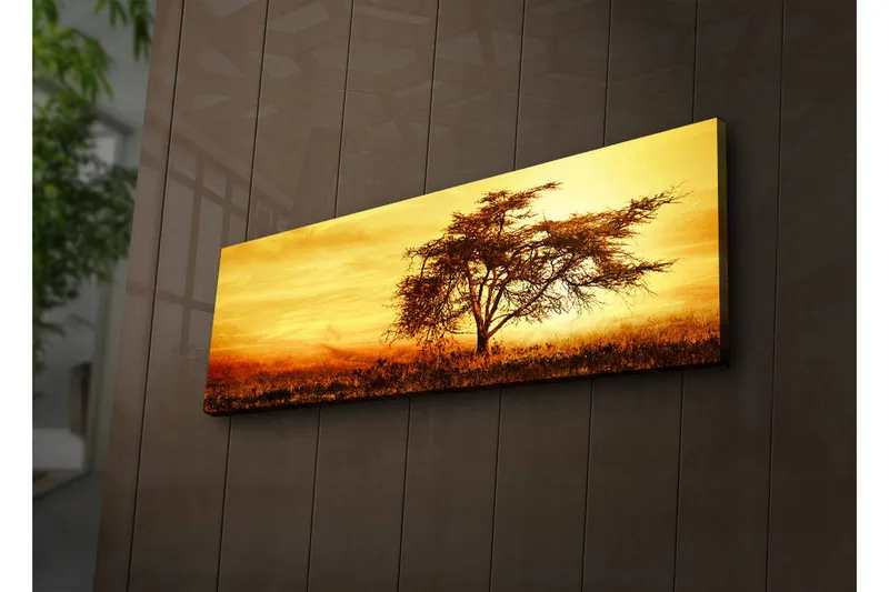 Canvas-taulu LED-valaistuksella 30x90 cm - Yksinäinen akaasiapuu kultaista auringonlaskua vasten, Kulta / Ruskea / Oranssi