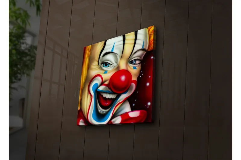 Canvas-taulu LED-valaistuksella 40x40 cm - Iloinen pelle värikkäällä meikillä ja punaisella nenällä, Punainen / Keltainen / Sininen