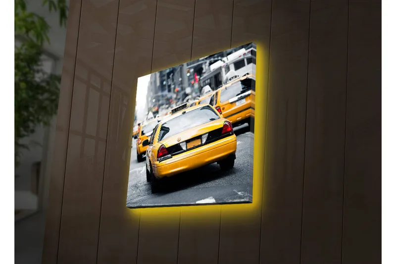 Canvas-taulu LED-valaistuksella 40x40 cm - Keltaiset taksit vilkkaalla kadulla, Keltainen / Musta / Harmaa