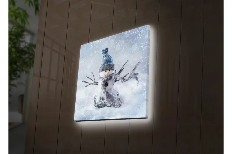 Canvas-taulu LED-valaistuksella 40x40 cm - Lumiukko talvimaisemassa lumisateella, Valkoinen / Sininen / Harmaa