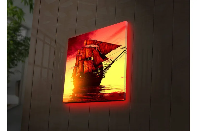 Canvas-taulu LED-valaistuksella 40x40 cm - Upea purjevene dramaattisessa auringonlaskussa, Punainen / Oranssi / Keltainen