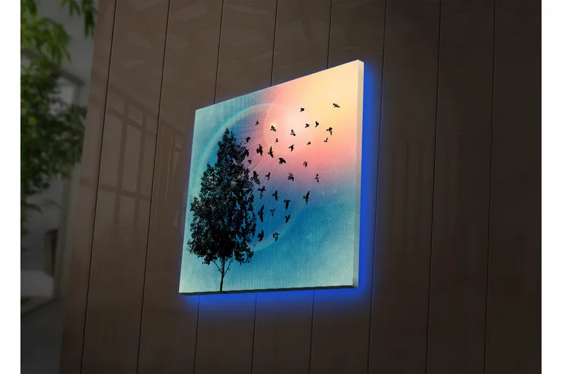 Canvas-taulu LED-valaistuksella 40x40 cm - Puun siluetti ja liitelevät linnut värikästä taustaa vasten, Sininen / Vaaleanpunainen / Vihreä