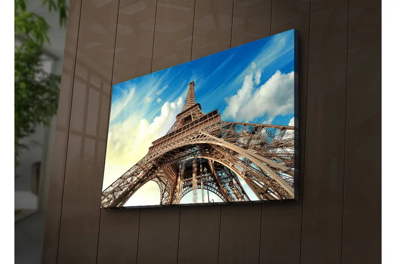 Canvas-taulu LED-valaistuksella 45x70 cm - Eiffel-torni dramaattisesta kulmasta nähtynä, Sininen / Beige / Valkoinen