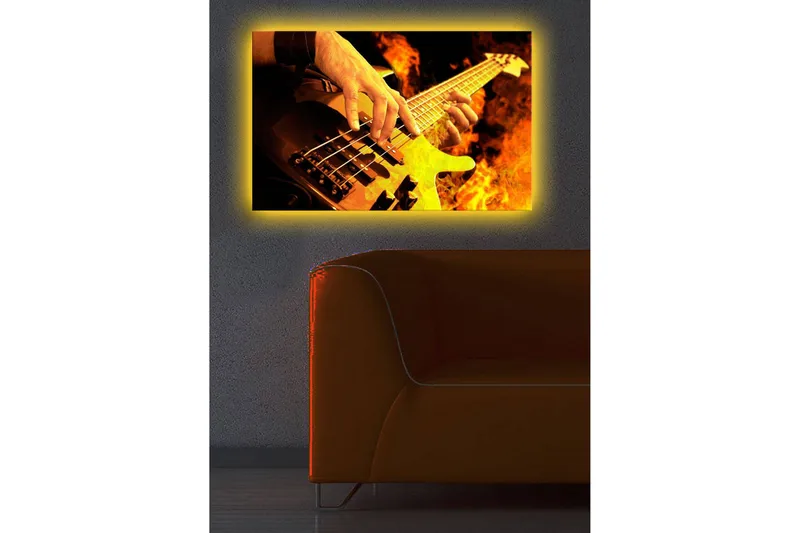 Canvas-taulu LED-valaistuksella 45x70 cm - Kitaristi soittaa sähköbassoa tulisien liekkien ympäröimänä - Oranssi / Musta / Keltainen - Sisustustuotteet - Taulu & taide - Canvas-taulu