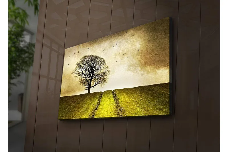 Canvas-taulu LED-valaistuksella 45x70 cm - Yksinäinen puunlatva vihreällä kukkulalla kultaisen taivaan alla, Kulta / Vihreä / Ruskea