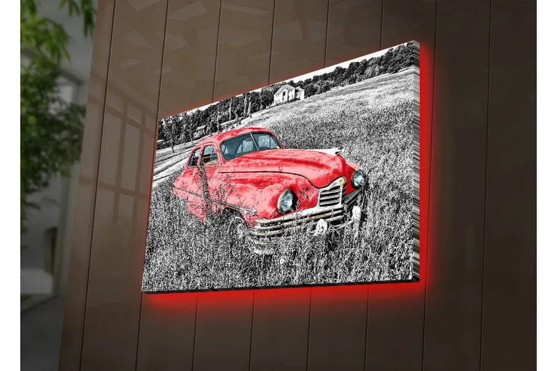 Canvas-taulu LED-valaistuksella 45x70 cm - Punainen vintage-auto rehevällä niityllä, Punainen / Musta / Harmaa