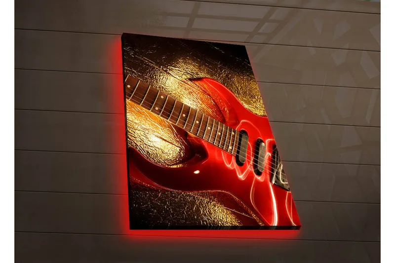 Canvas-taulu LED-valaistuksella 70x45 cm - Kiiltävän punainen sähkökitara kultaisella taustalla, Punainen / kulta