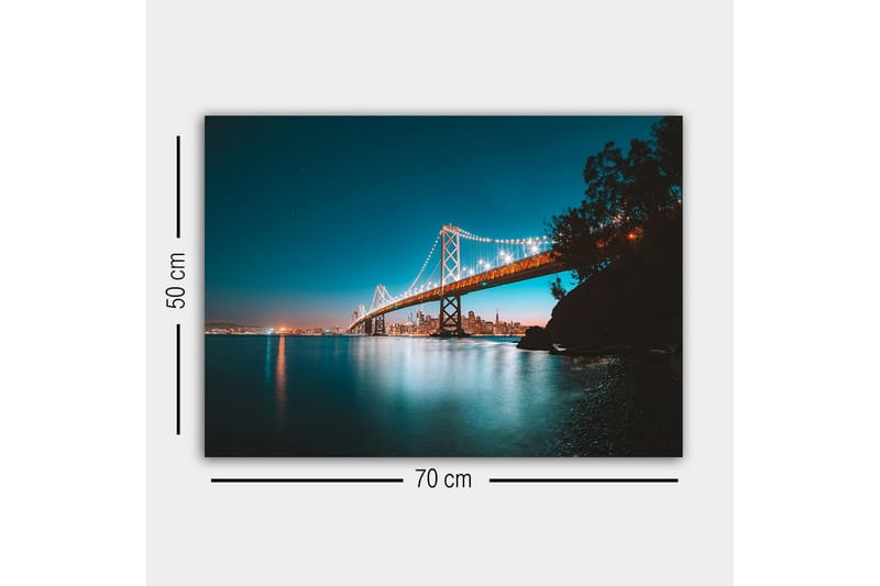 Canvas-taulu - Valaistu silta tyynen veden pinnan yli, taustalla kaupungin siluetti - Sininen / Oranssi / Musta - Sisustustuotteet - Taulu & taide - Canvas-taulu