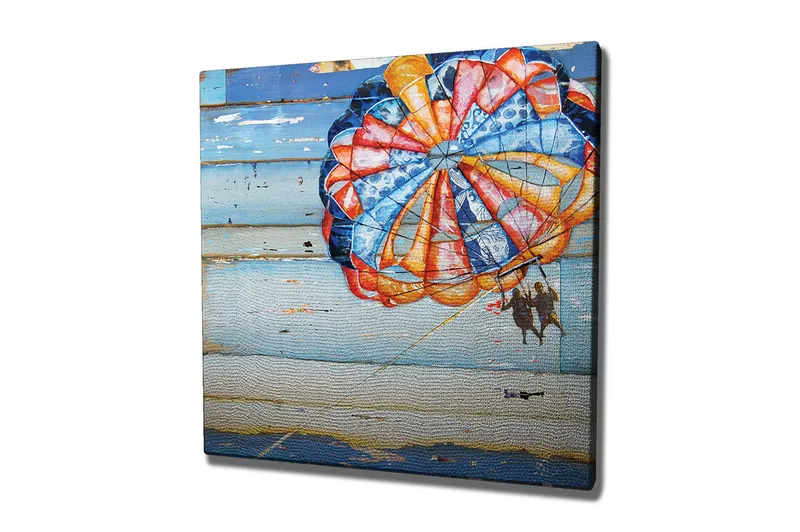 Canvastaulu 45x45 cm - Värikäs laskuvarjo, jossa kaksi ihmistä leijuu meren yllä, Sininen / Oranssi / Punainen