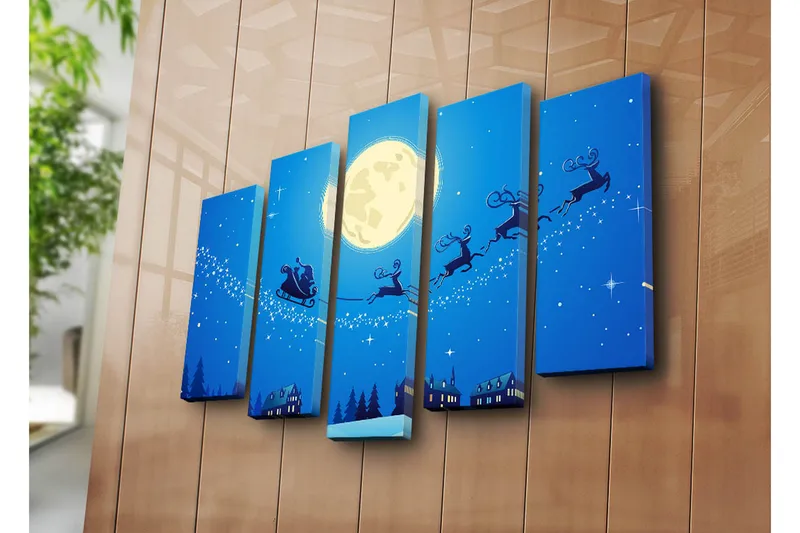 Suuri 5-osainen canvas-taulu, 105x70 cm - Jouluyö, jossa joulupukki lentää kaupungin yllä porojen kanssa reessä - Tummansininen / Vaaleansininen / Valkoinen - Sisustustuotteet - Taulu & taide - Canvas-taulu