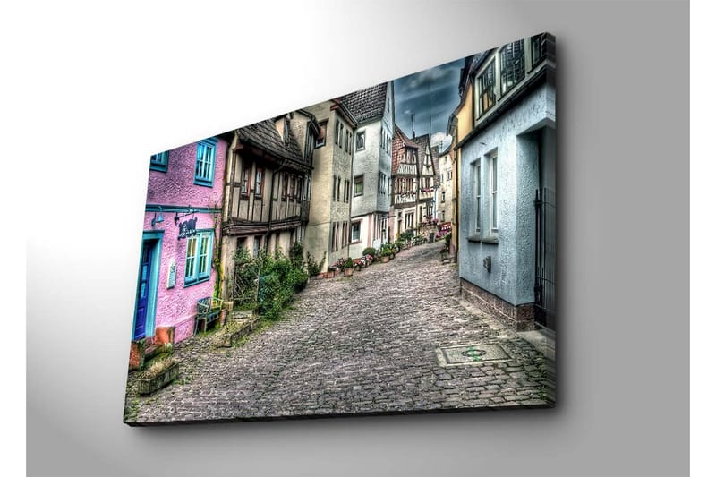 Suurikokoinen canvas-taulu 100x70 cm - Värikäs katu viehättävine taloineen viehättävässä kylässä - Vaaleanpunainen / Sininen / Harmaa - Sisustustuotteet - Taulu & taide - Canvas-taulu